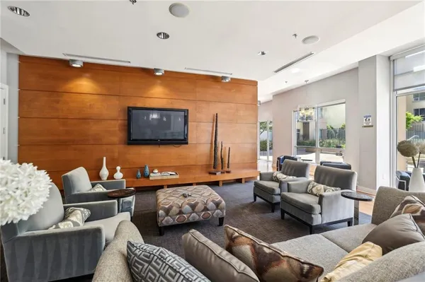 a view of a building with garden and sitting area