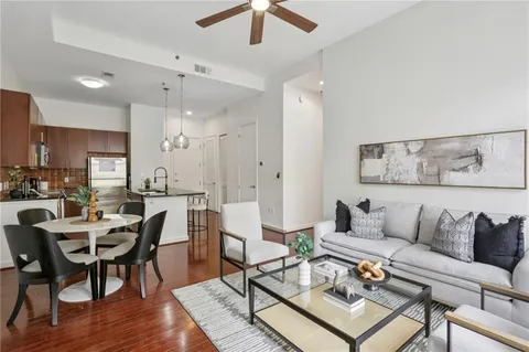 a view of a livingroom with furniture and hardwood floor
