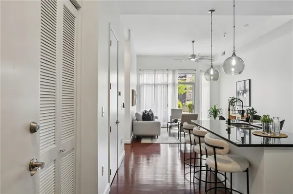 a kitchen with a dining table and a chandelier