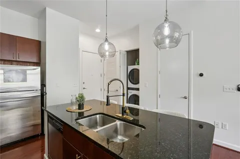 a living room with furniture and a mirror