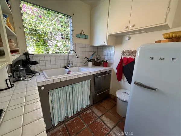 a bathroom with a sink toilet and a window