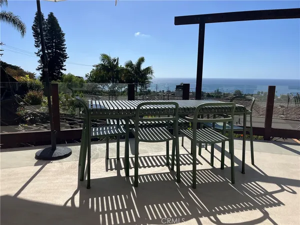 a view of a balcony with furniture
