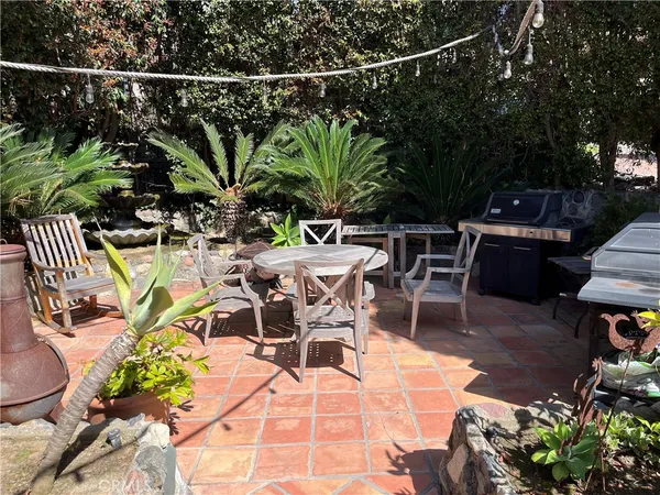 a view of a backyard with sitting area
