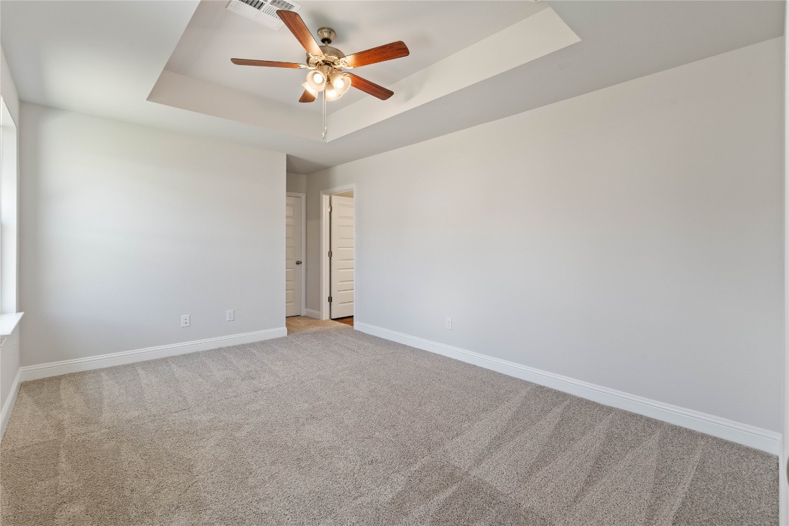 10641 Ellerston Road Cleveland, TX 77327 - Photo 16 of 34 an empty room with a ceiling fan and a window