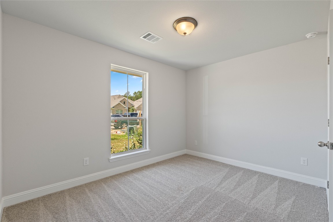 10641 Ellerston Road Cleveland, TX 77327 - Photo 23 of 34 an empty room with windows