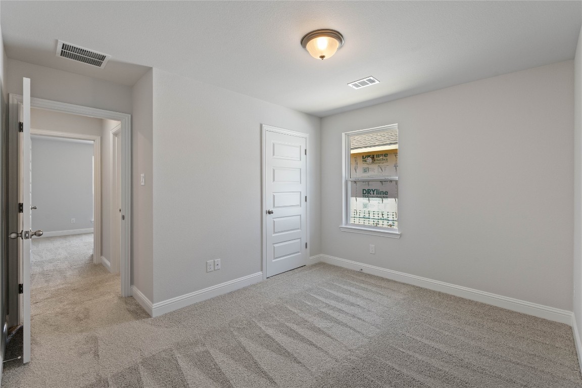 10641 Ellerston Road Cleveland, TX 77327 - Photo 26 of 34 a view of an empty room with window and closet area