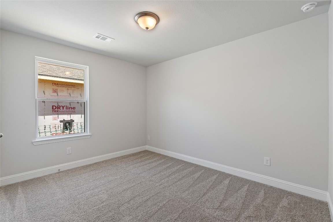 10641 Ellerston Road Cleveland, TX 77327 - Photo 27 of 34 an empty room with a window