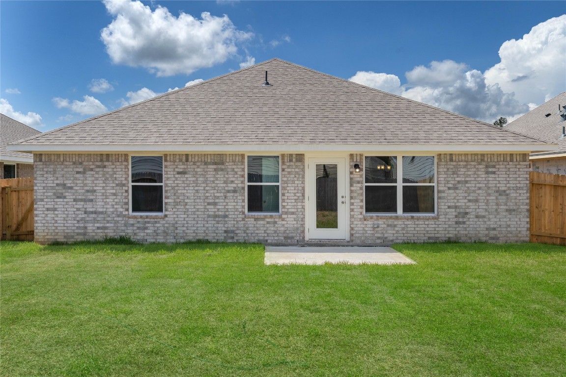 10641 Ellerston Road Cleveland, TX 77327 - Photo 32 of 34 a view of a house with a yard and a large window