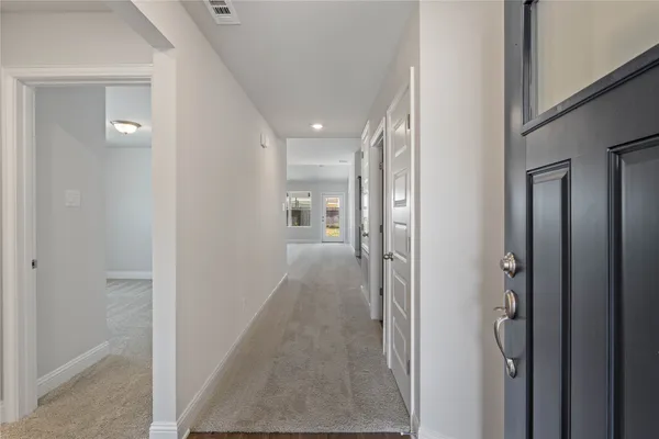 a view of hallway with livingroom