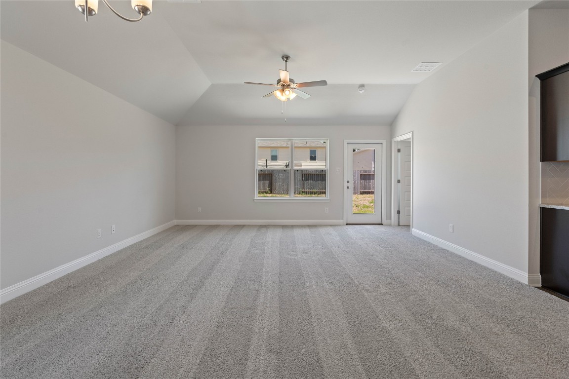 10641 Ellerston Road Cleveland, TX 77327 - Photo 5 of 34 wooden floor in an empty room with a window