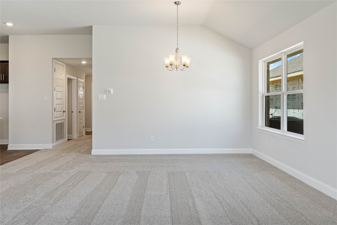 10641 Ellerston Road Cleveland, TX 77327 - Photo 10 of 34 an empty room with wooden floor and windows