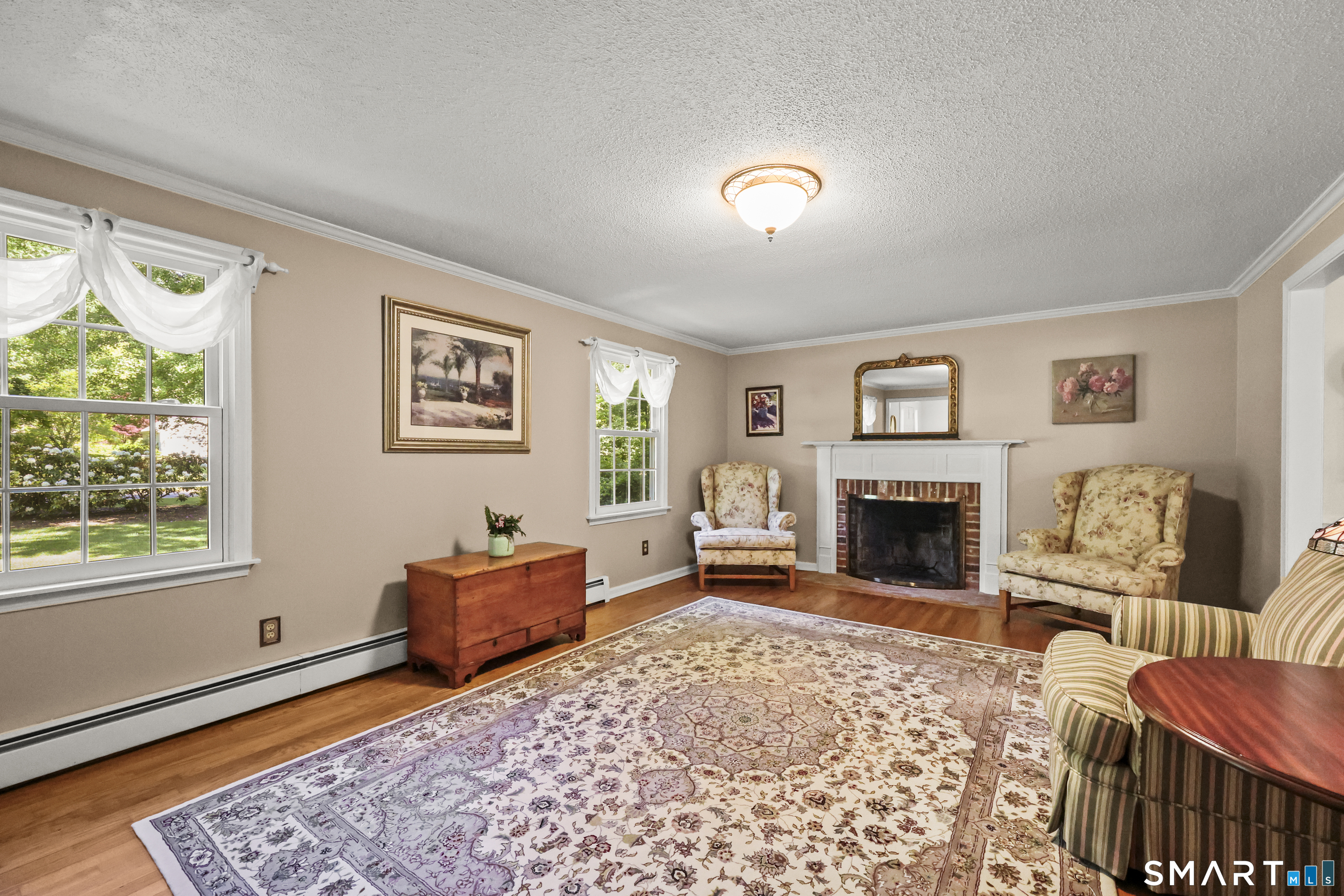 17 Briar Hill Road Avon, CT 06001 - Photo 7 of 38 A second fireplace creates an ideal setting for gatherings or quiet nights in the spacious living room.