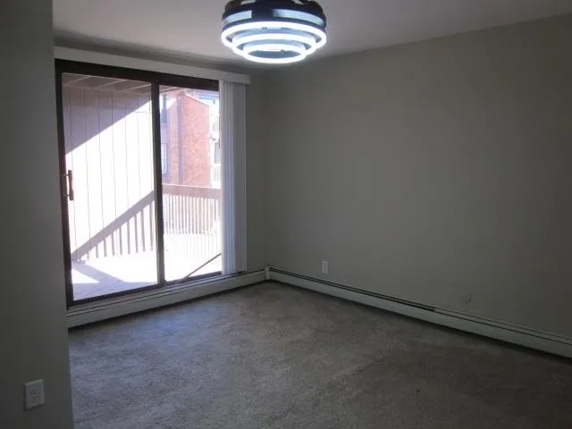 a view of a balcony with wooden floor