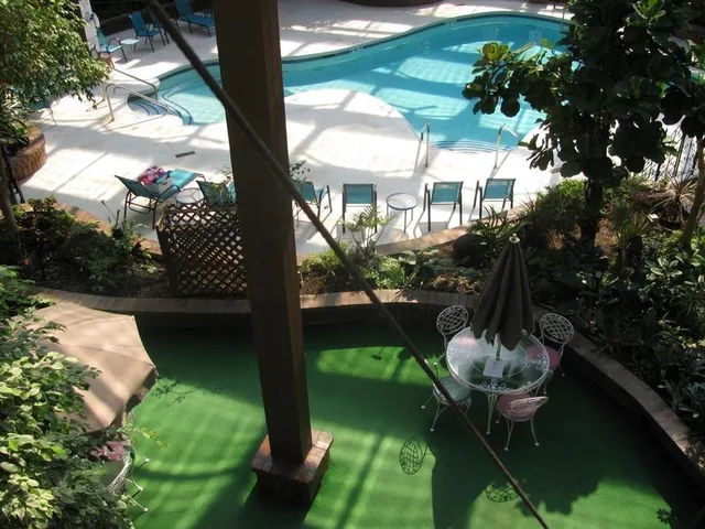 a bed room with a bed and a chair