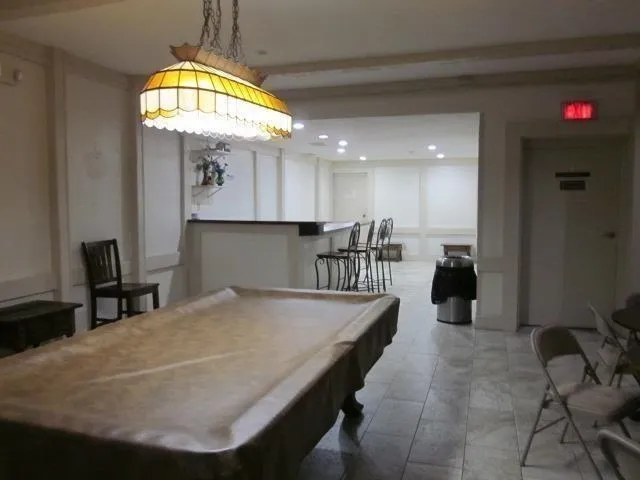 a room with gym equipment and windows