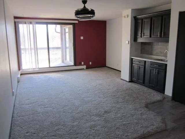 a kitchen with stainless steel appliances a stove and a refrigerator