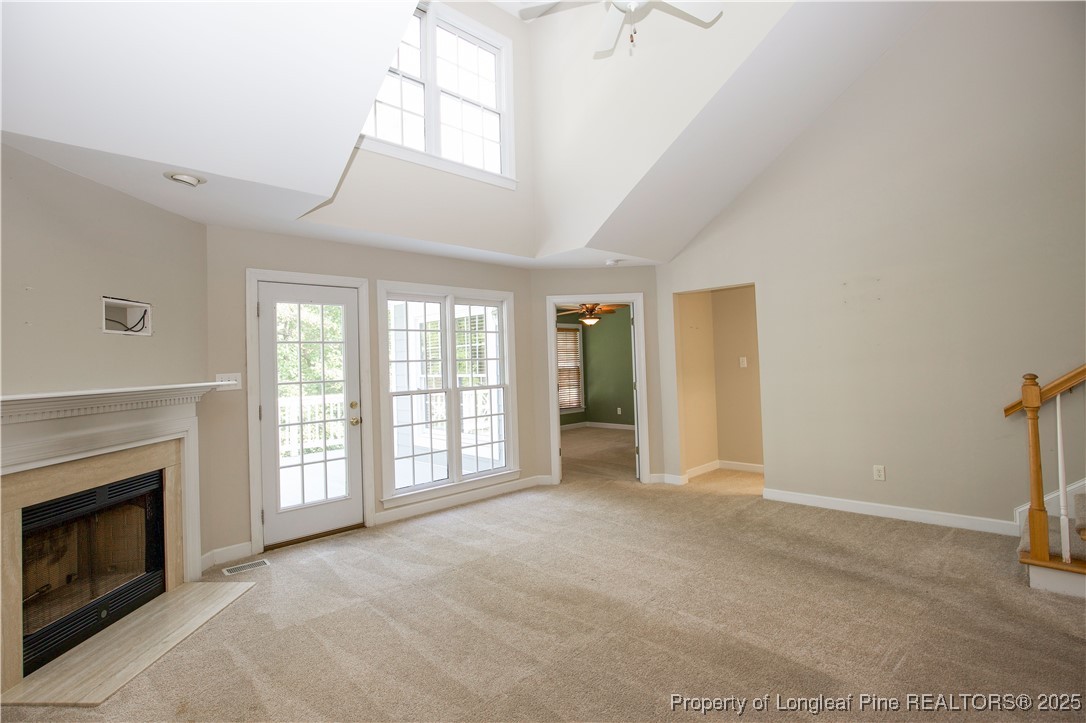 175 Knoll Road Southern Pines, NC 28387 - Photo 17 of 50 a view of an empty room with a fireplace and a window