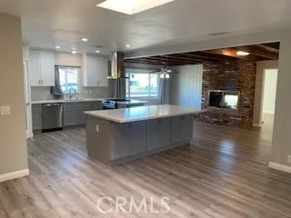 a kitchen with a stove sink and window