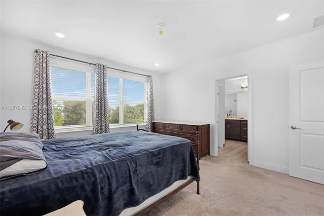 a bathroom with a toilet and a window