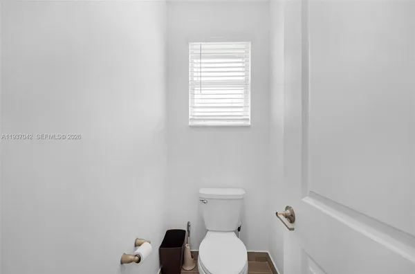 a bathroom with a double vanity sink mirror and shower