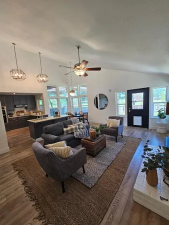 a kitchen with a table chairs stove and microwave