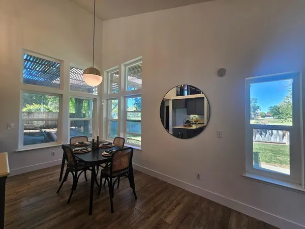 a workspace with furniture and wooden floor