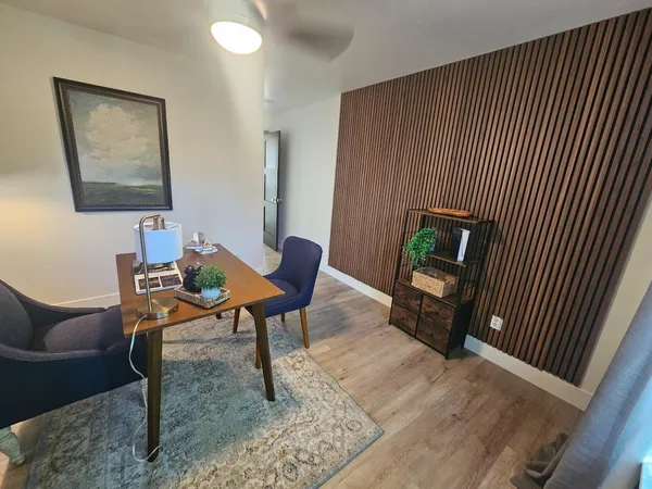 a view of a room that has a door and a toilet in it