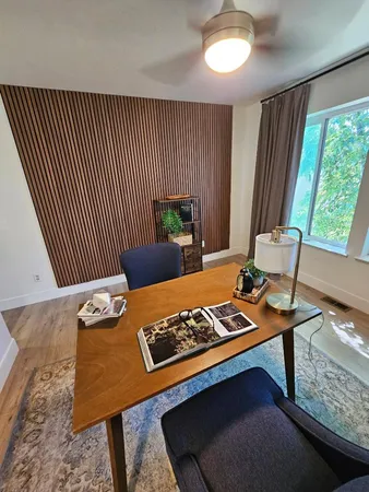 a kitchen with a table chairs and entryway