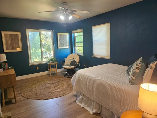 a bedroom with bed and window