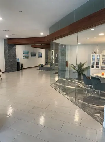 a room with lots of table and chairs