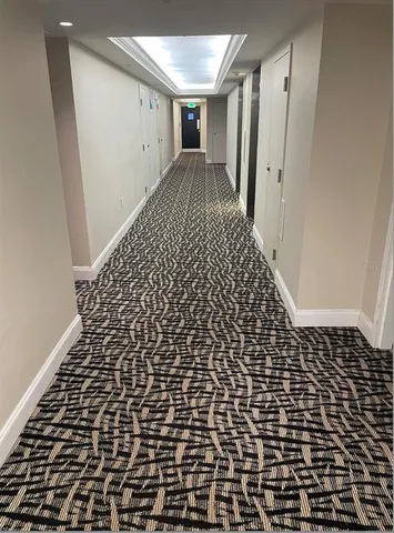 a bathroom with a black white checkered floor