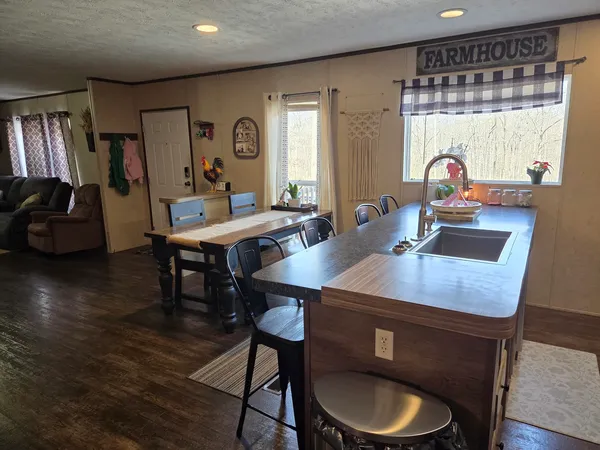 a view of a dining room with furniture and window