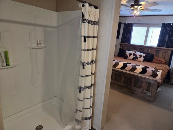 a bedroom with bed and a closet