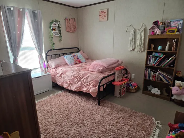 a room with a flat chair and a flat screen tv