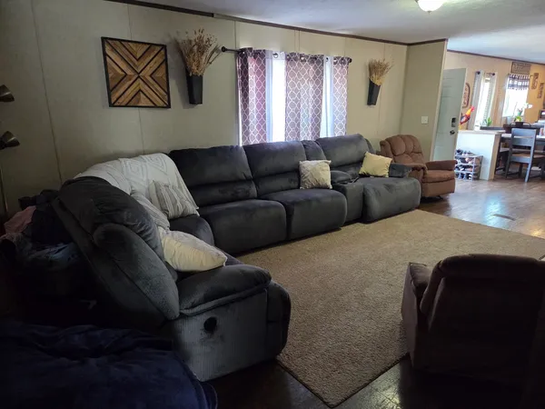 a living room with furniture and a window