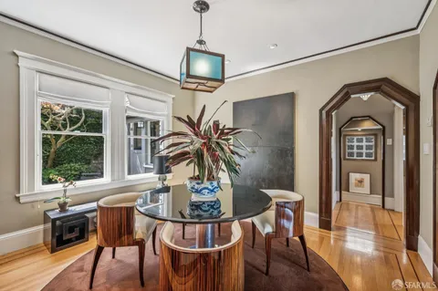 a kitchen with stainless steel appliances a stove a sink and a refrigerator