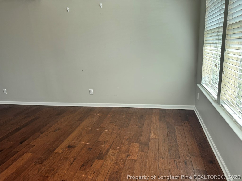350 River Oak Street Spring Lake, NC 28390 - Photo 12 of 27 a view of a room with wooden floor and window