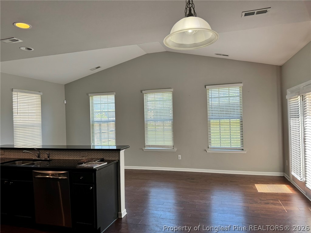350 River Oak Street Spring Lake, NC 28390 - Photo 13 of 27 a view of an empty room with wooden floor and a window