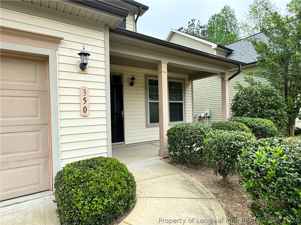 350 River Oak Street Spring Lake, NC 28390 - Photo 3 of 27 a view of a house with a yard
