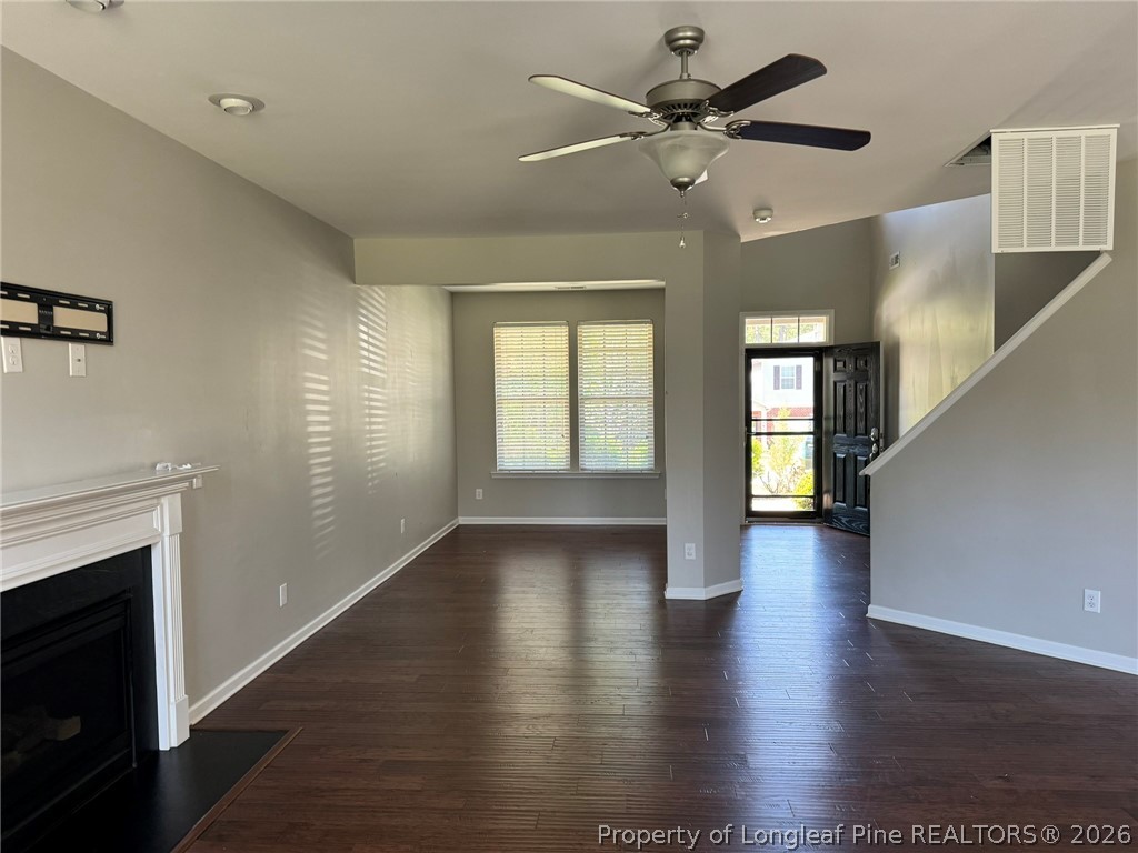 350 River Oak Street Spring Lake, NC 28390 - Photo 6 of 27 a view of an empty room with window and wooden floor