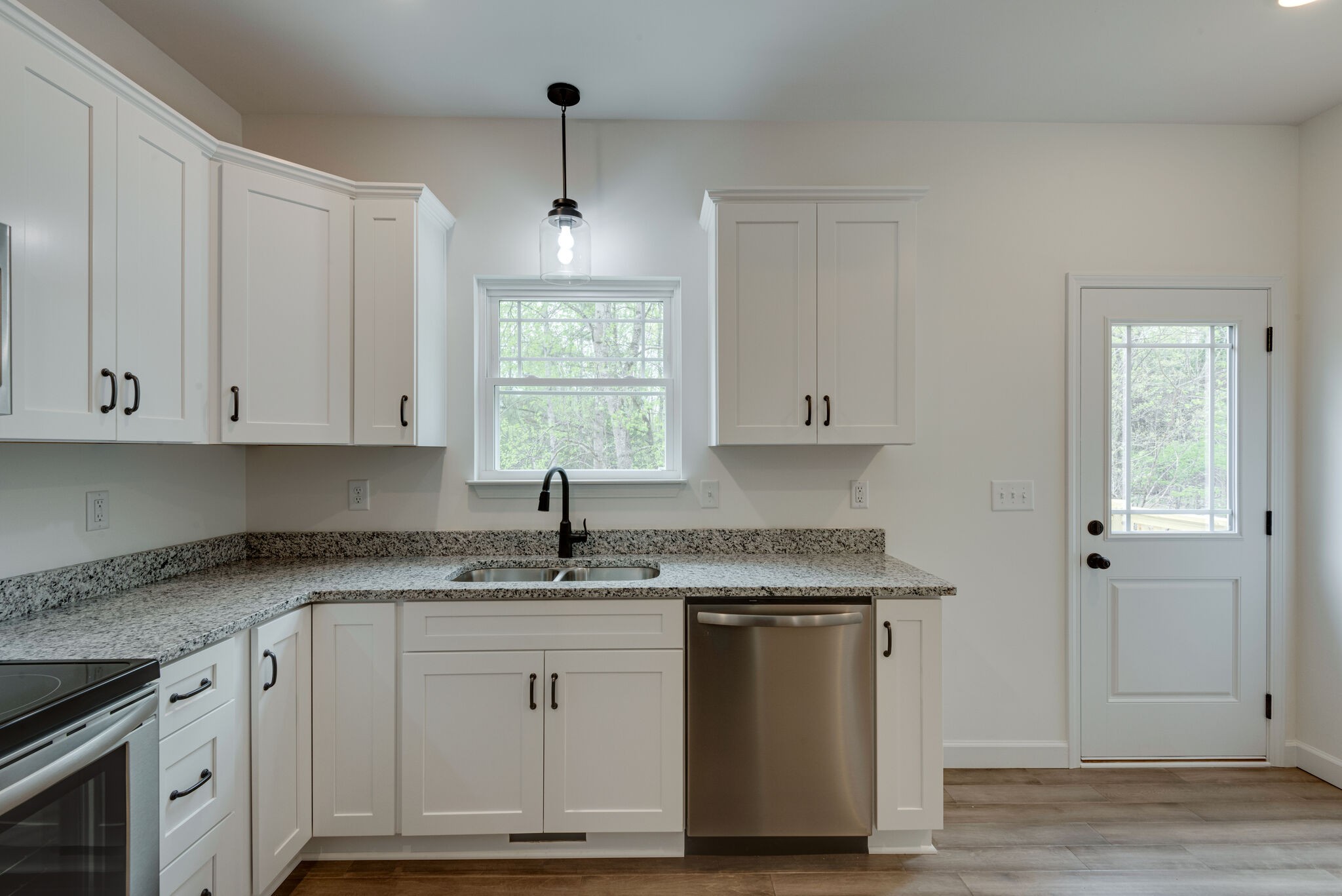 774 Lucas Road Dickson, TN 37055 - Photo 8 of 29 a kitchen with granite countertop white cabinets and a sink