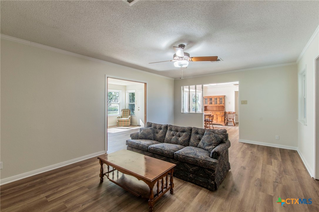 517 Thompson Road Troy, TX 76579 - Photo 4 of 25 a living room with furniture and a wooden floor
