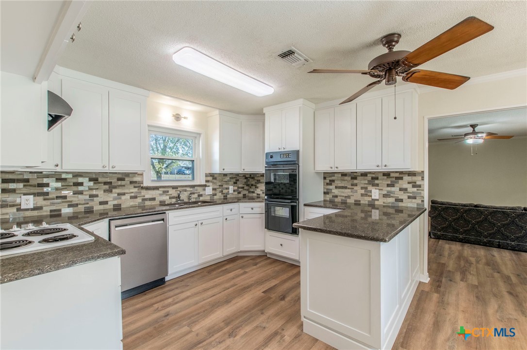 517 Thompson Road Troy, TX 76579 - Photo 5 of 25 a kitchen with stainless steel appliances granite countertop a sink and cabinets