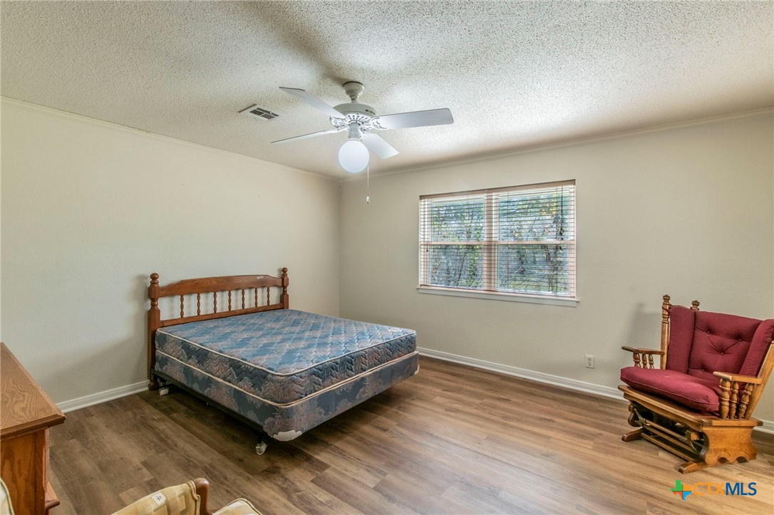 517 Thompson Road Troy, TX 76579 - Photo 9 of 25 a room with a couch and wooden floor