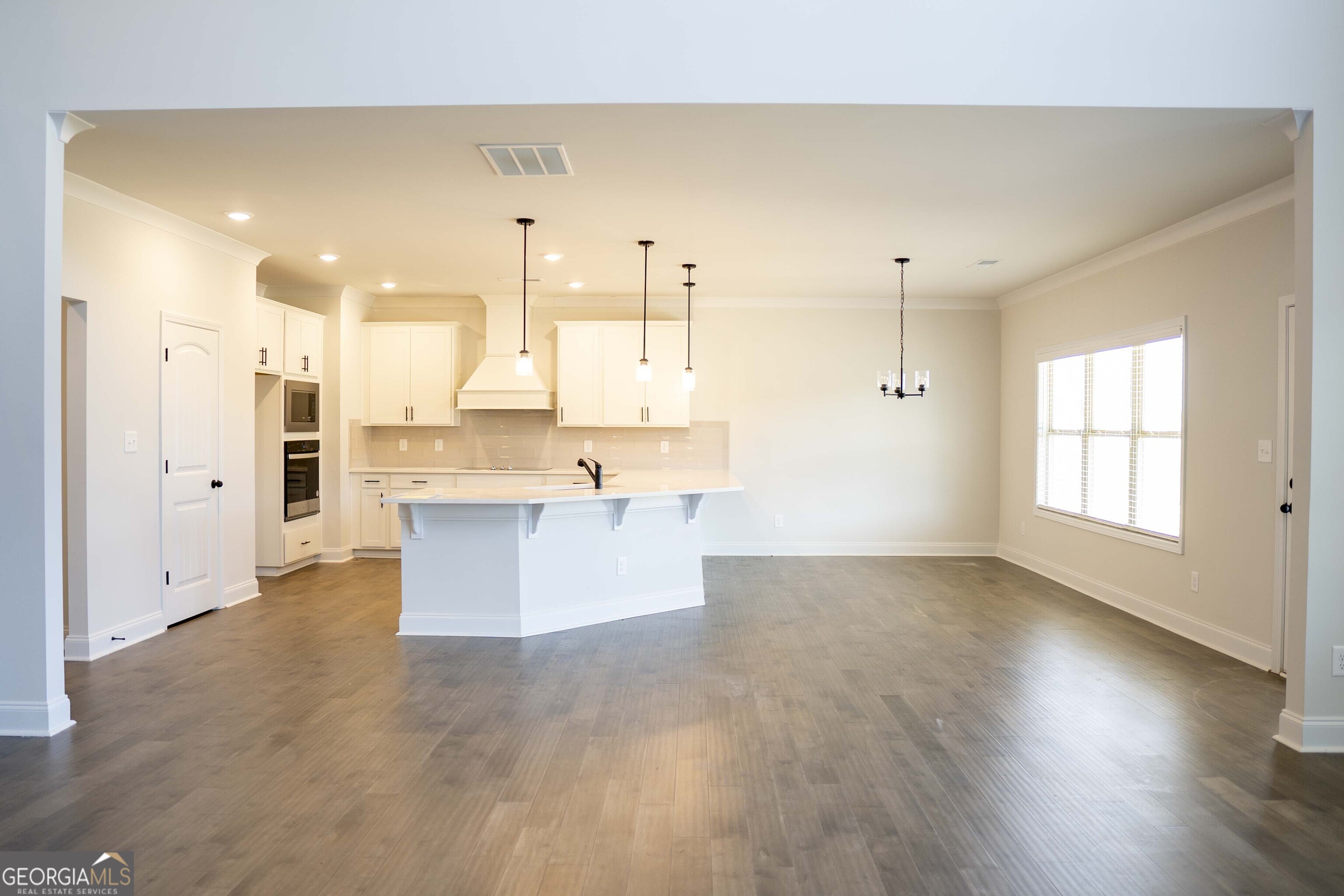 600 Beaver Court Perry, GA 31069 - Photo 14 of 48 a view of kitchen with wooden floor