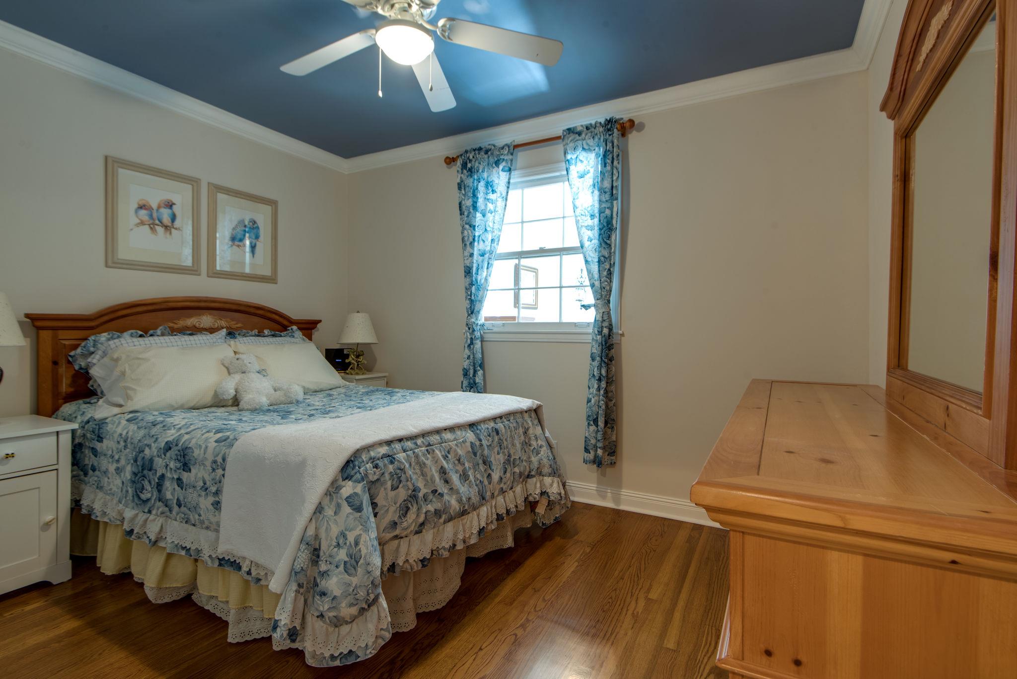 716 Murfreesboro Road Franklin, TN 37064 - Photo 16 of 30 Bedroom 5 with a Ceiling Fan, Crown Molding and Hardwood Floors