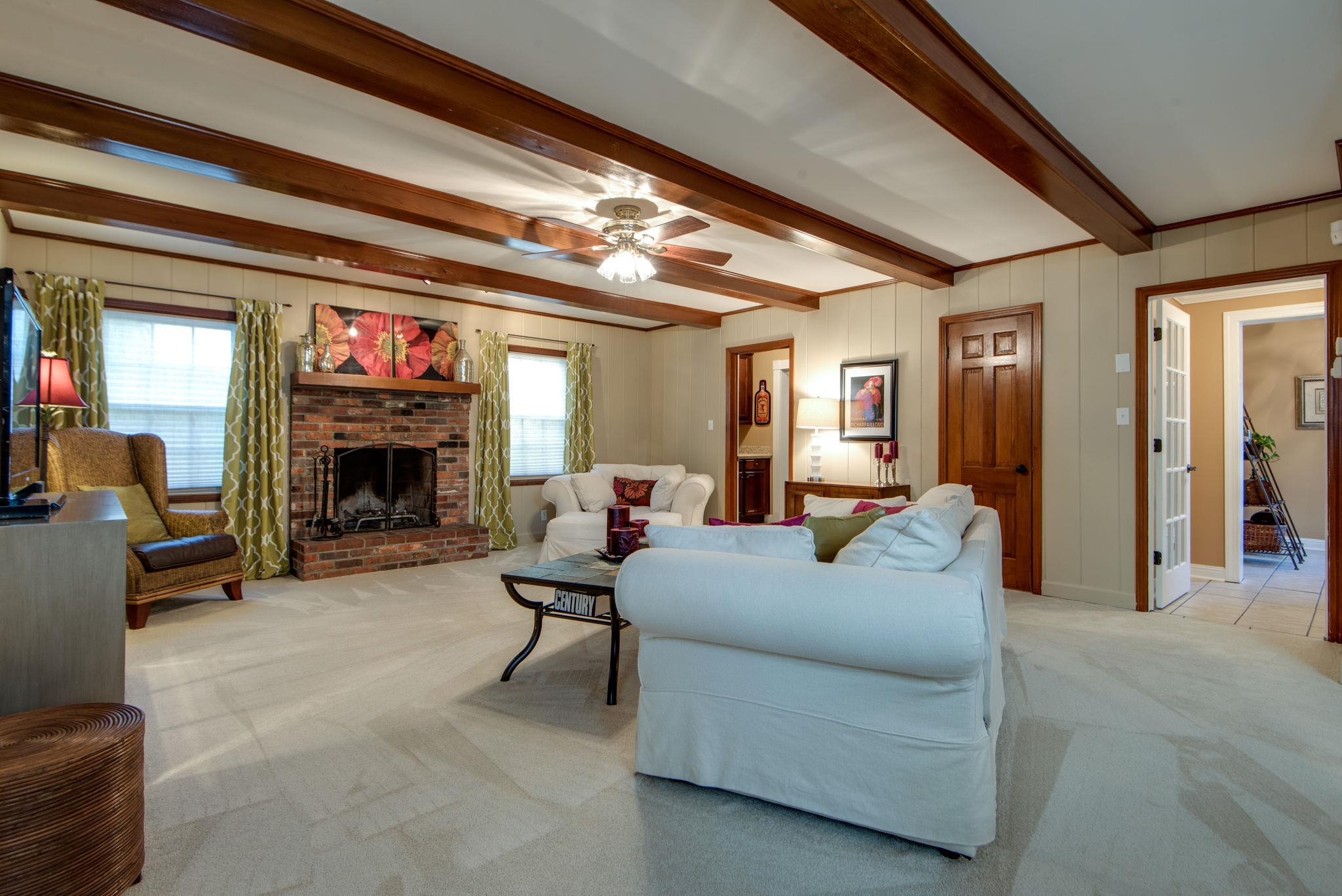 Living Room/Great Room with Wood Burning Fireplace (also has a gas starter) and Wood Beams