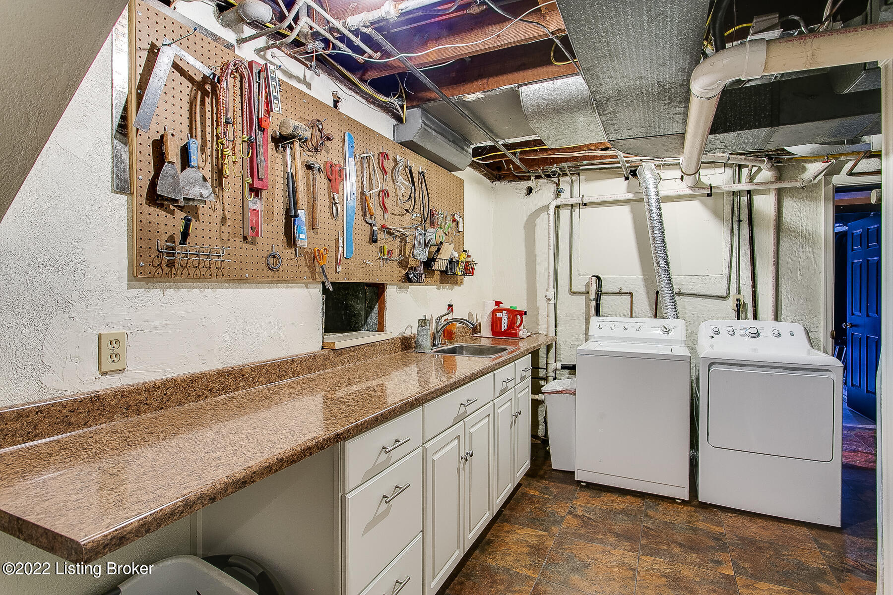 560 Sunset Road Louisville, KY 40206 - Photo 76 of 88 Lower level laundry room with access to a laundry chute from the 1st and 2nd floors. One HVAC system in this room.