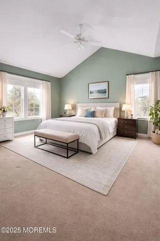 a spacious bedroom with a bed and window