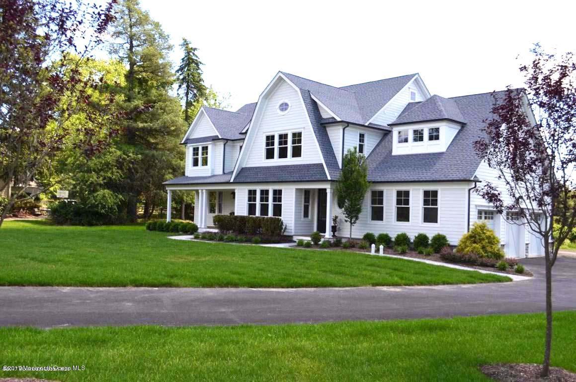 3 Forrest Way Colts Neck, NJ 07722 - Photo 1 of 26 a front view of a house with a garden